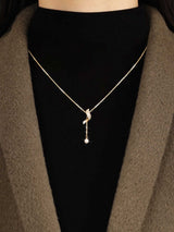 Full Diamond Geometric Tassel Pearl Necklace Clavicle Chain worn by a model.