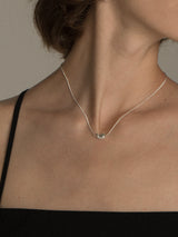 Elegant And Versatile Gold Bean Ingot Classic Necklace worn by a model, showcasing its beautiful design and high quality.