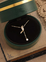 Full Diamond Geometric Tassel Pearl Necklace Clavicle Chain displayed in a green jewelry box.