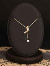 Full Diamond Geometric Tassel Pearl Necklace Clavicle Chain displayed on a black necklace stand